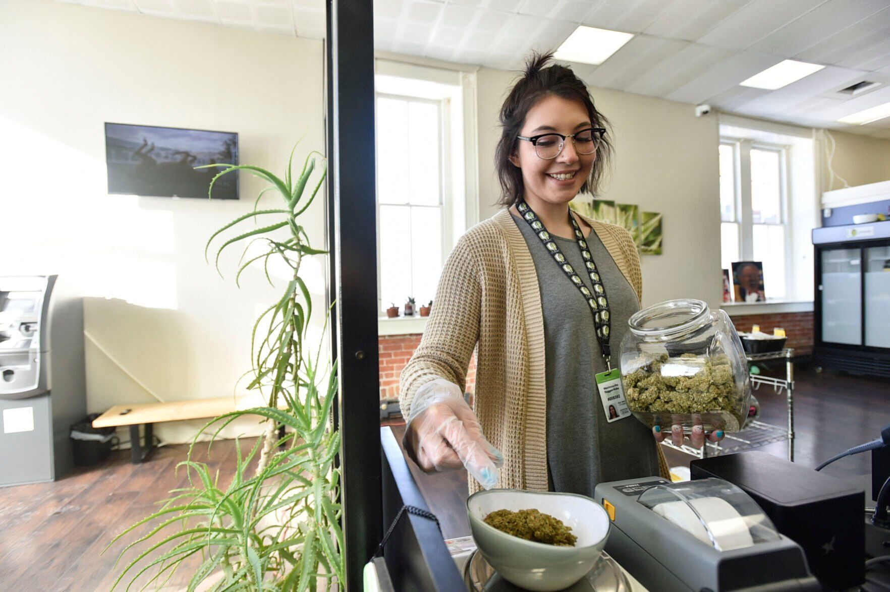 WasiinNaytha RaggedRobe weighs marijuana buds